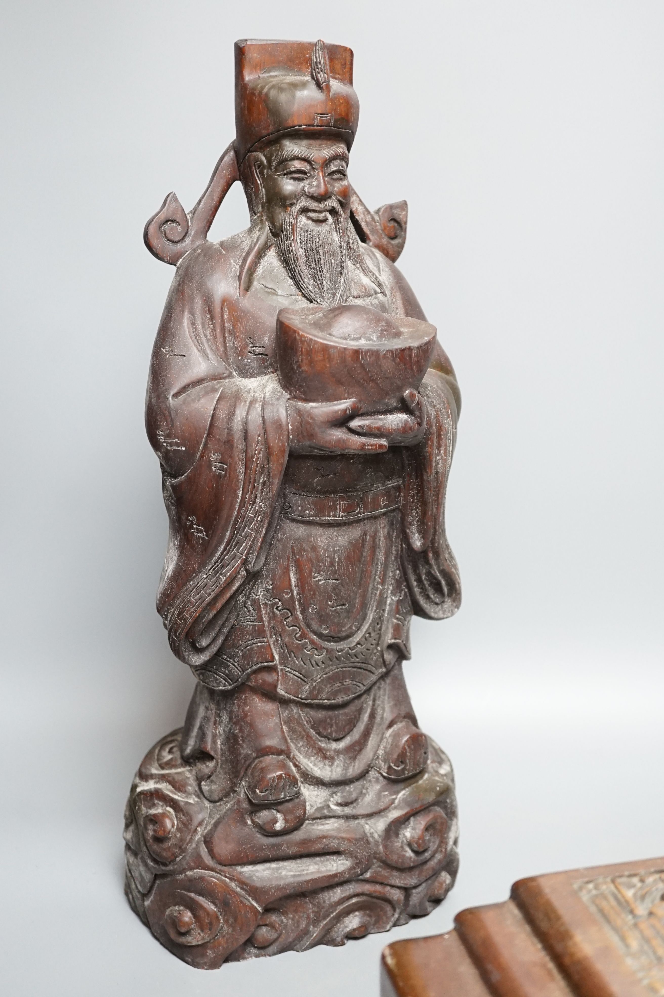 A Chinese carved wood sage and small carved trunk, Sage 47 cms high.